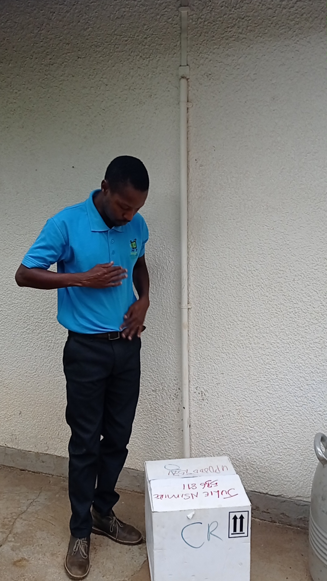 Mambo Medical staff with labeled delivery package
